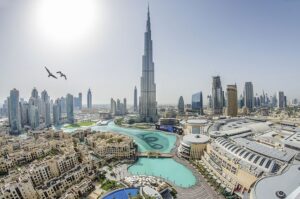 Dubai real estate founder building LinkedIn personal brand on laptop